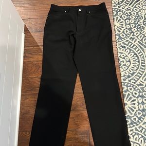 Men’s black dress pants.